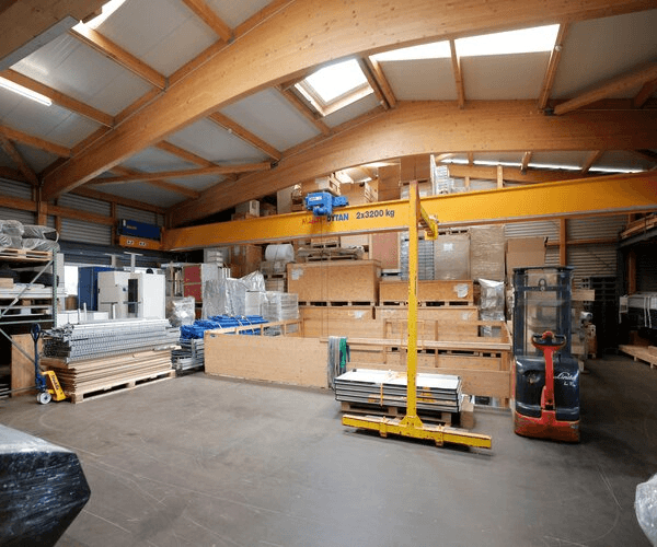 Walker's Team rental facility warehouse with overhead crane and equipment storage